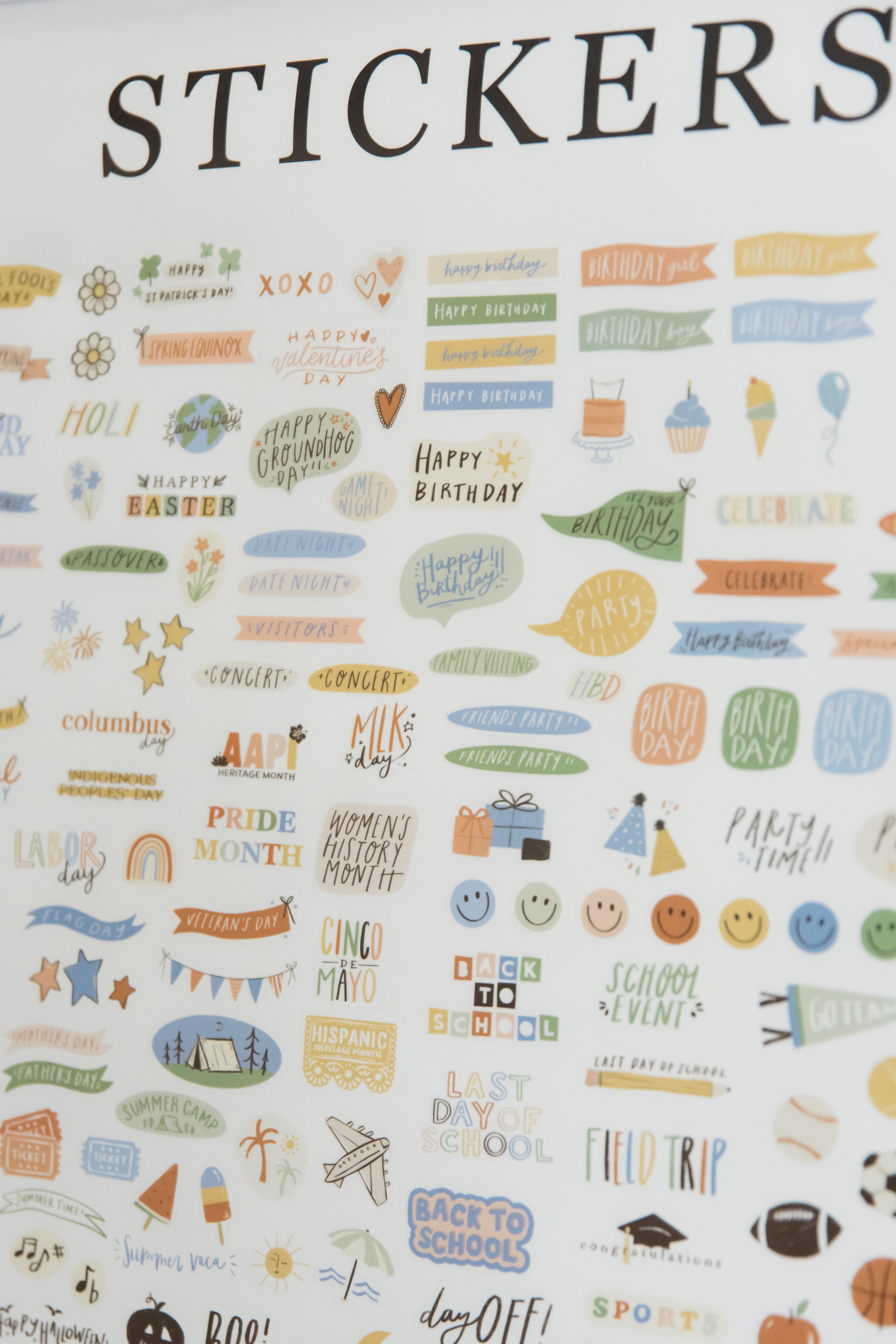 Close-up of colorful calendar stickers for birthdays, holidays, and appointments