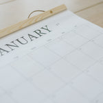 January page of the large wall calendar with its cedar wood hanger