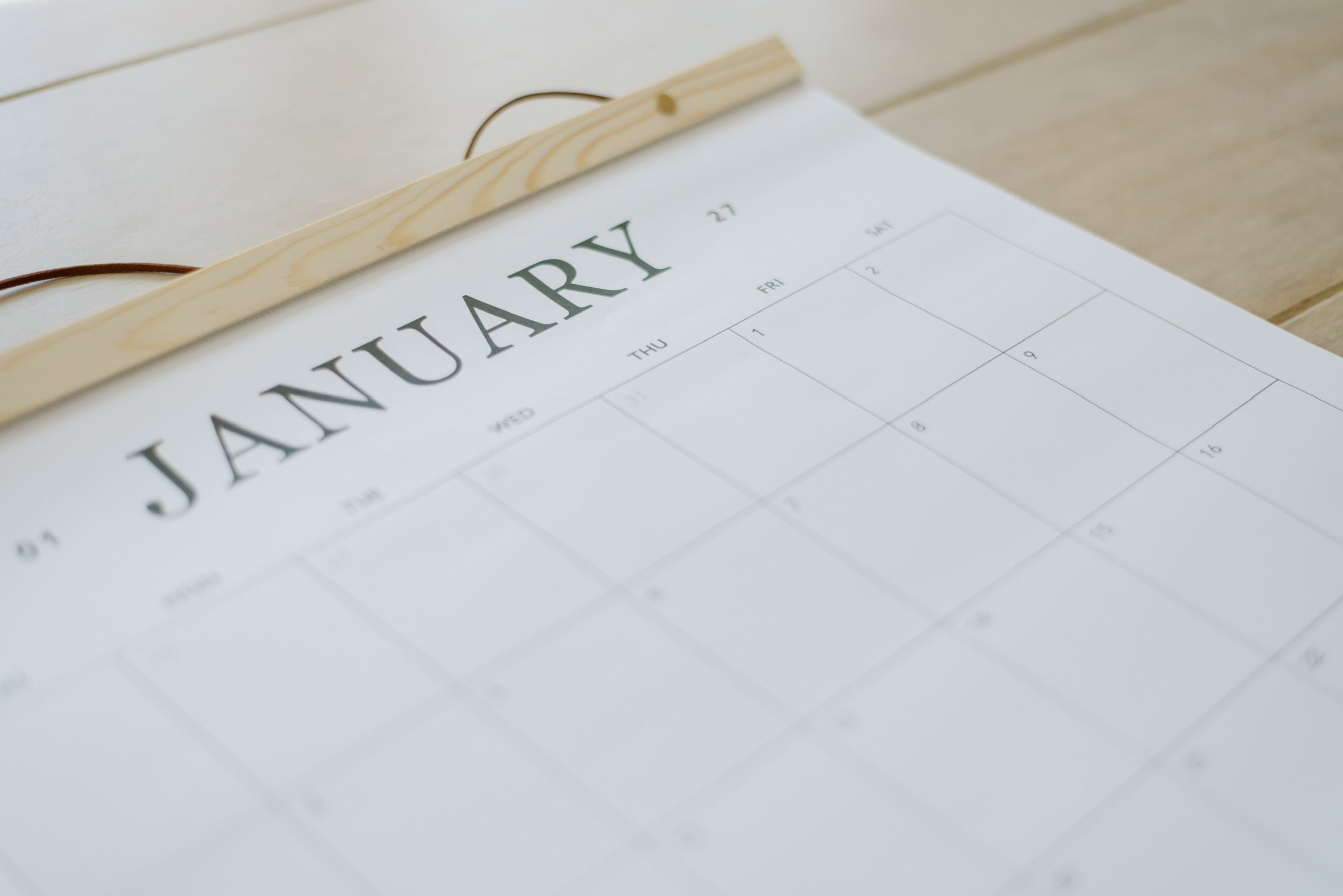 January page of the large wall calendar with its cedar wood hanger