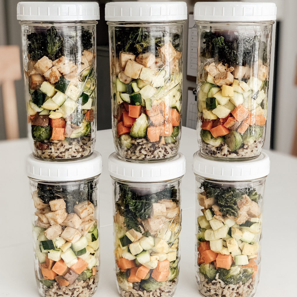 Roasted vegetables, rice and tofu in jars with lids