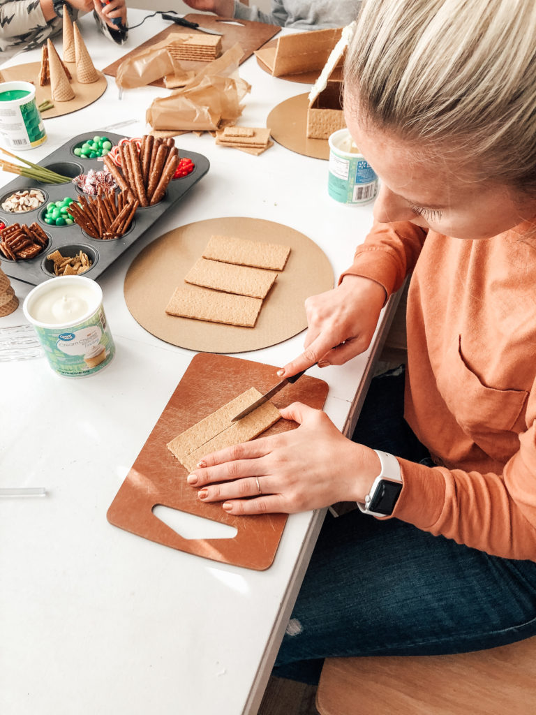 Cut the graham crackers with a serrated knife for easy gingerbread house assembly