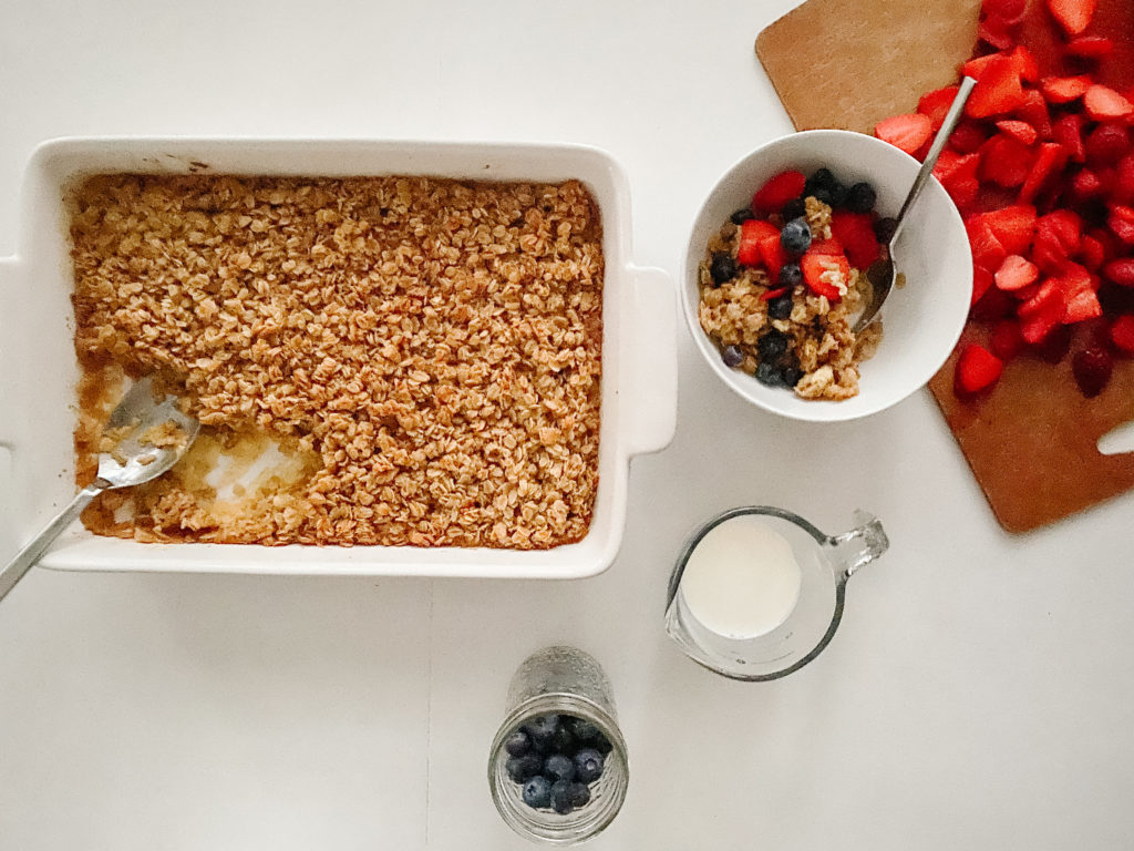 Baked Oatmeal in a dish, with milk and berries