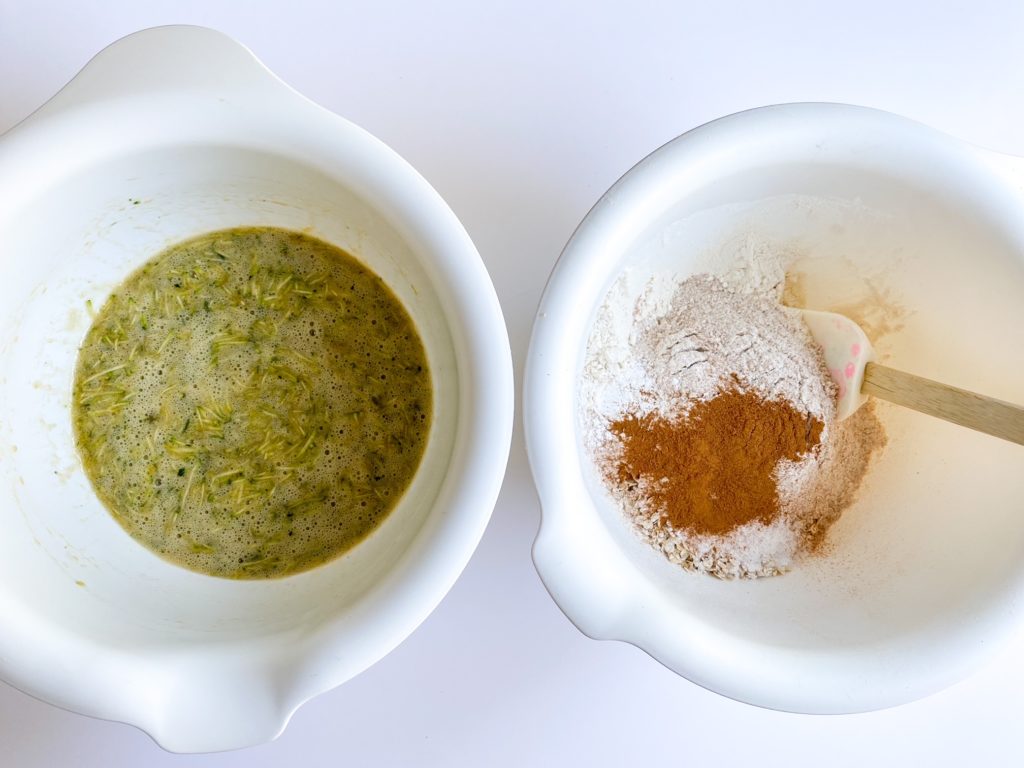 Wet and dry ingredients in separate bowls on a table