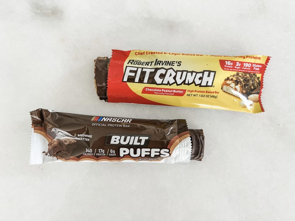 Built Puffs and Fit Crunch bars on a counter top