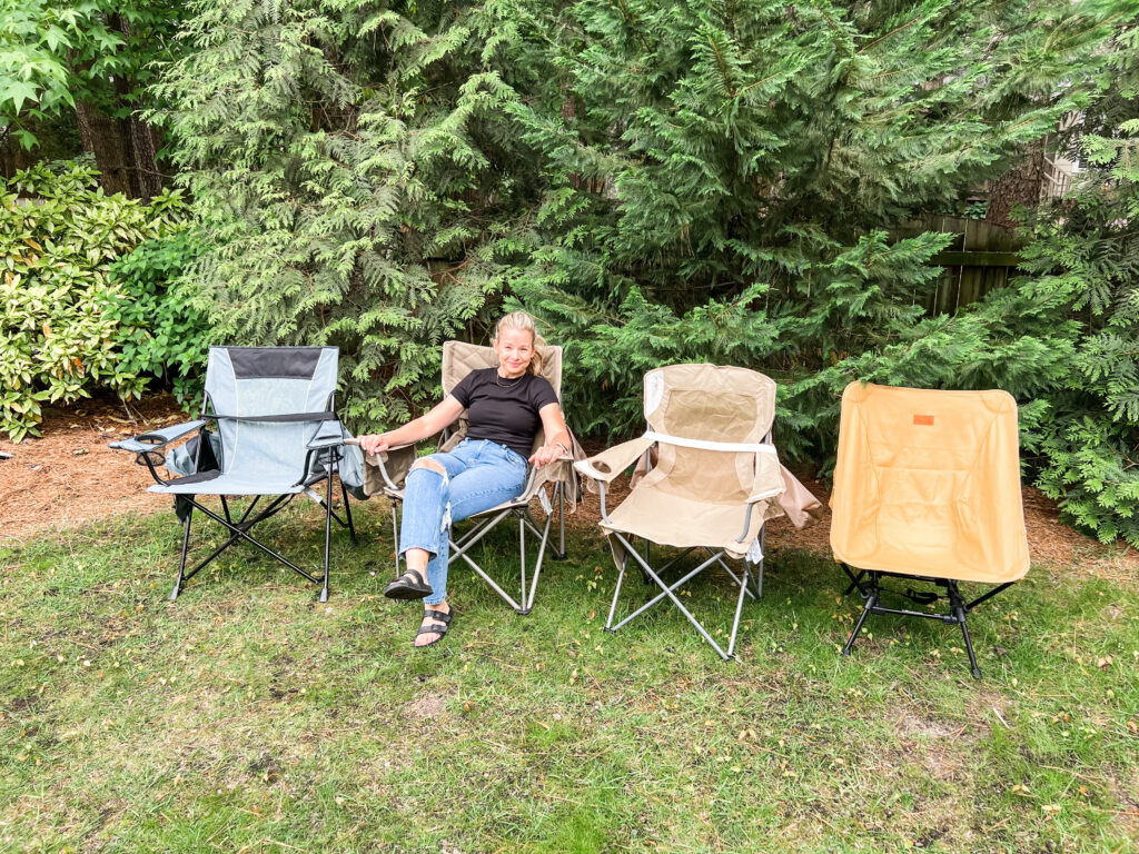 Brittney sitting in a camping chair with other camping chairs in a row next to her