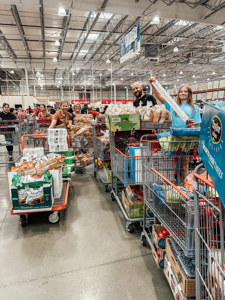 Brittney and family buying girls' camp food at Costco